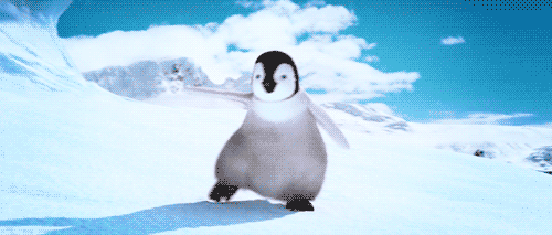 Гифка Эрик из Happy Feet весело танцует на снегу.